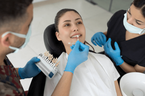 dental professionals working on a patient before veneer placement