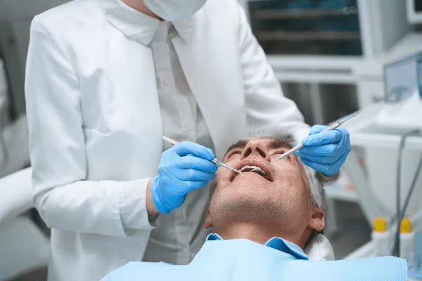 image of an elderly man during a dental treatment